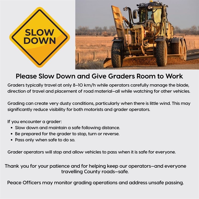 Caution around working motor graders